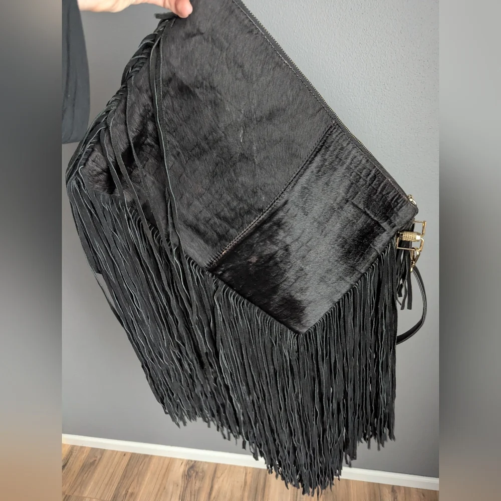 Black leather Fringe crossbody bag feels like cow leather. No tags. No brand tag